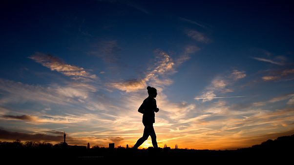 A jogger is silhouetted against the morning sky during sunrise in Hannover, northern Germany, Jan. 3, 2014. (AP Photo/dpa, Julian Stratenschulte) A jogger is silhouetted against the morning sky during sunrise in Hannover, northern Germany, Jan. 3, 2014. (AP Photo/dpa, Julian Stratenschulte)