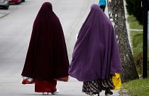 Two women Walk through the town of Flen, some 100 km west of Stockholm in 2018.