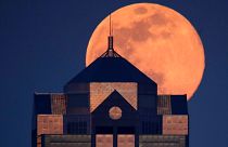 Last month's supermoon rising behind a downtown office building in Kansas City, Mo., Tuesday, April 7, 2020.