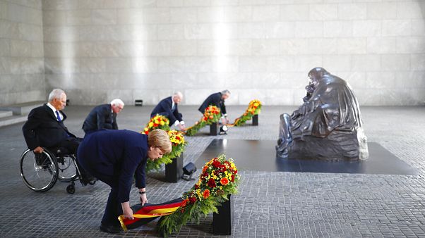 German Chancellor Angela Merkel and other officials lay wreaths at the Neue Wache Memorial in Berlin, Germany, May 8, 2020. German Chancellor Angela Merkel and other officials lay wreaths at the Neue Wache Memorial in Berlin, Germany, May 8, 2020.