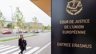  a woman walks by the entrance to the European Court of Justice in Luxembourg. 