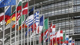 The European flag, left, and the Union Jack, right, fly with other European flags outside the European Parliament in Strasbourg, France, Jan.31, 2020. 