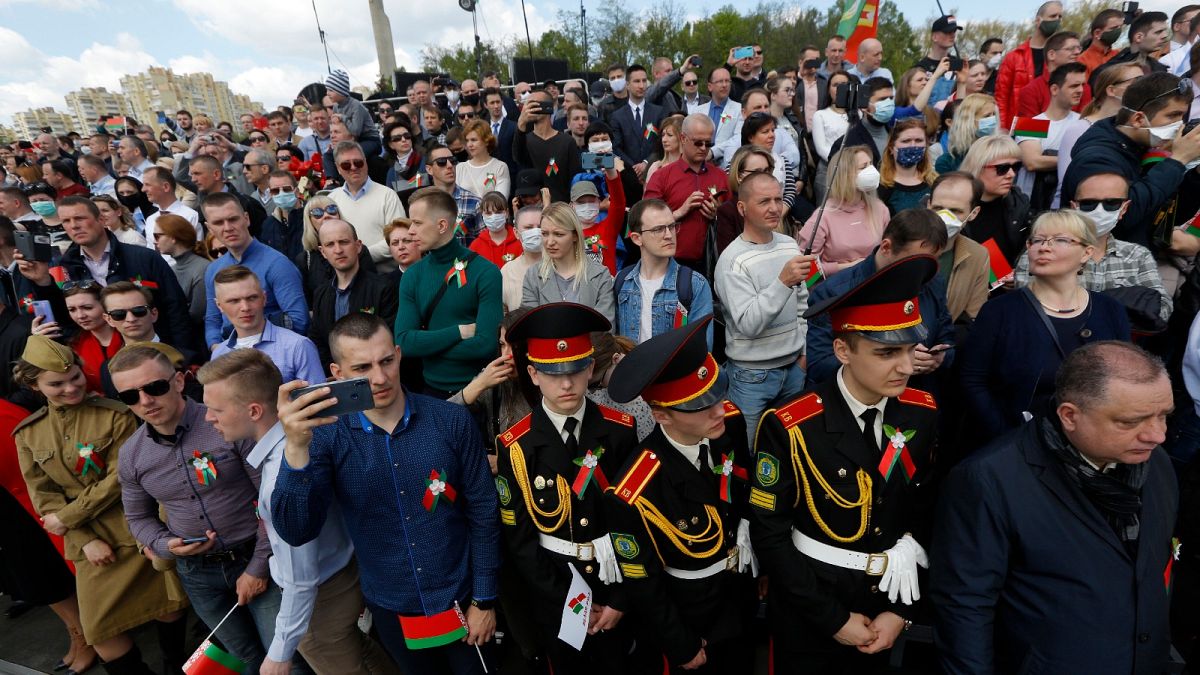 People attend the Victory Day military parade that marked the 75th anniversary of the allied victory over Nazi Germany, in Minsk, Belarus, Saturday, May 9, 2020