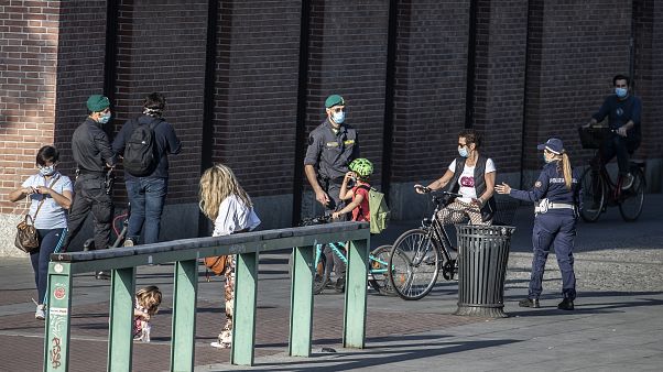 Extra police officers patrol Europe's streets and beaches as lockdown restrictions ease Extra police officers patrol Europe's streets and beaches as lockdown restrictions ease