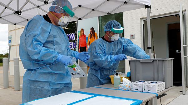 In this April 2, 2020, file photo, nurses set up a COVID-19 testing station for pre-screened pediatric patients. In this April 2, 2020, file photo, nurses set up a COVID-19 testing station for pre-screened pediatric patients.