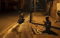 A Muslim worshipper offers prayer on a street outside the Jama Masjid on the first day of Ramadan during a nationwide lockdown, in New Delhi, India, Saturday, April 25, 2020