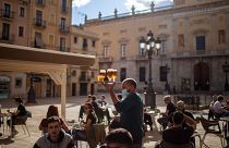 People enjoy drinks in Tarragona, Spain