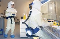 Scientists conduct research with corona viruses at the Helmholtz Centre for Infection Research HZI, in Brunswick, Germany, May 8, 2020.
