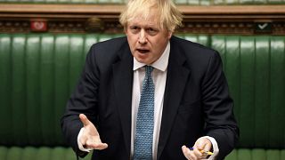 In this handout photo provided by UK Parliament, Britain's Prime Minister Boris Johnson speaks during Prime Minister's Questions in the House of Commons, London.