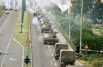 Tanks and jeeps of the Yugoslav Army cross a bridge on way back to the Marshal-Tito-Barracks in Zagreb on Wednesday, July 3, 1991.