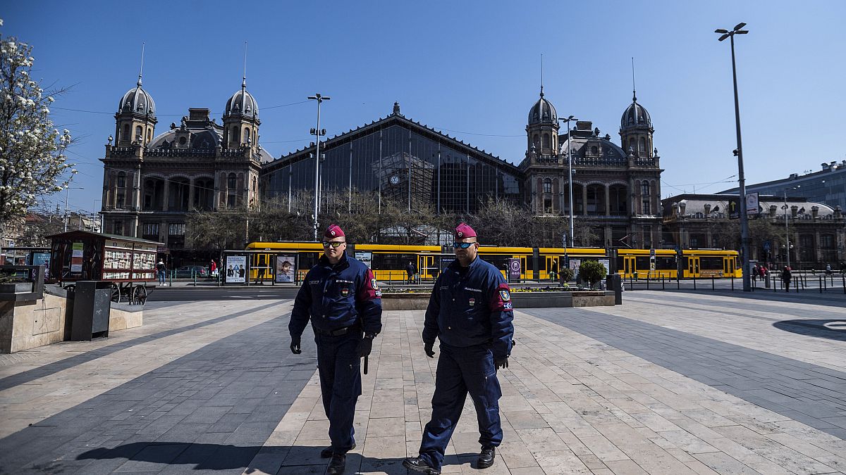 Police officers patrol in central Budapest, Hungary, 3 April, 2020.