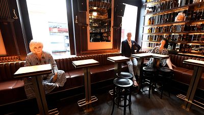 Dummies are placed in a bar in Vienna to help customers keeping the distance on May 14, 2020 amid the novel coronavirus COVID-19 pandemic.
