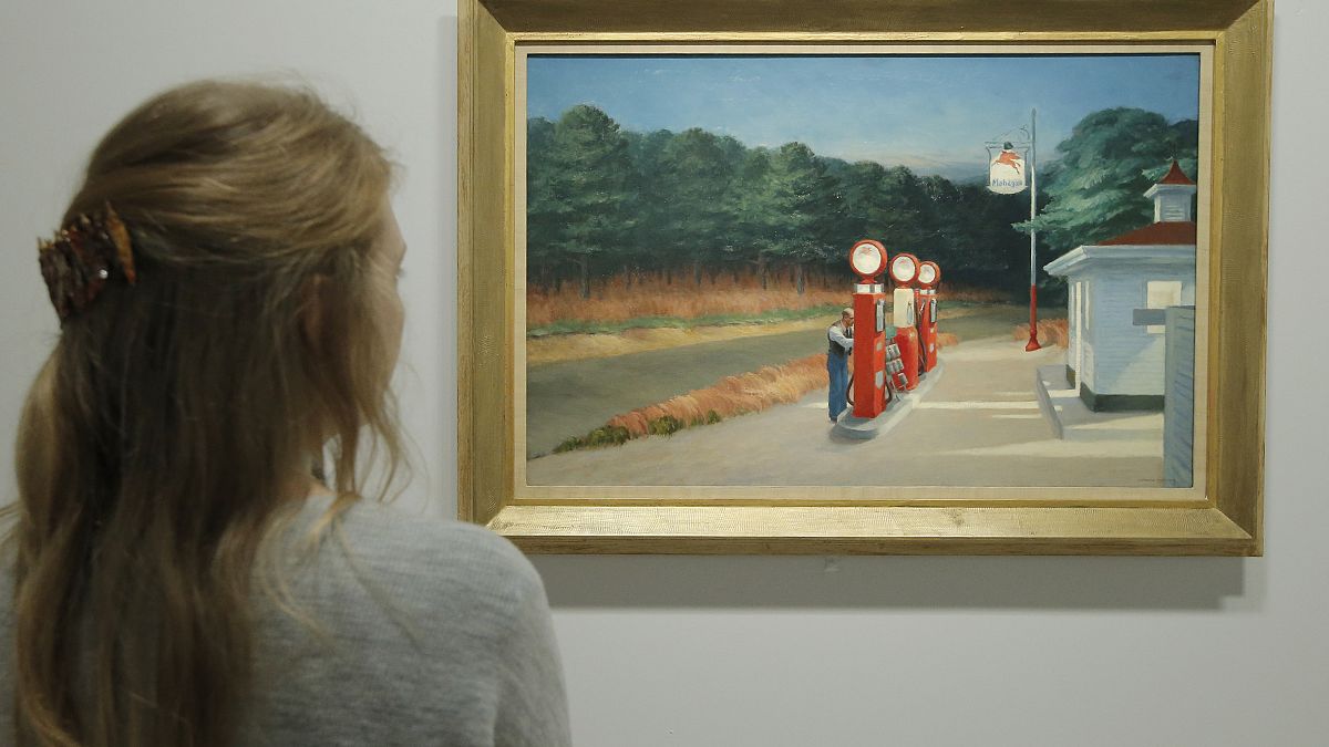 A woman looks at "Gas 1940" as part of the retrospective of Edward Hopper, one of the great American 20th century artists in 2012.