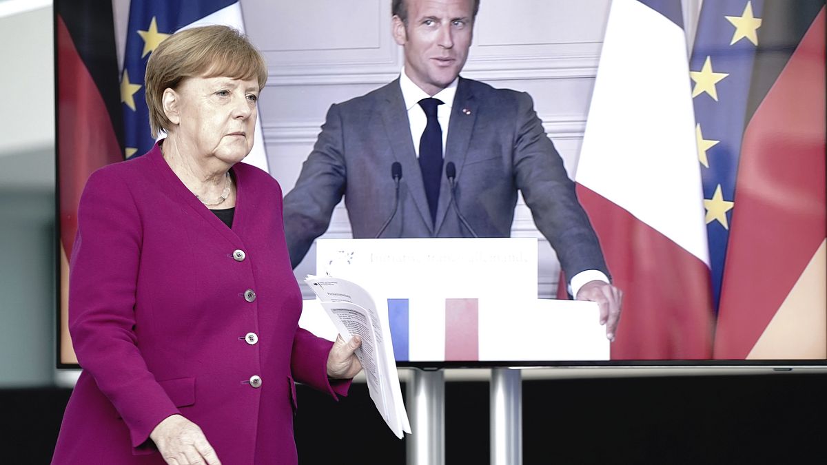 German Chancellor Angela Merkel arrives for a news conference with French President Emmanuel Macron