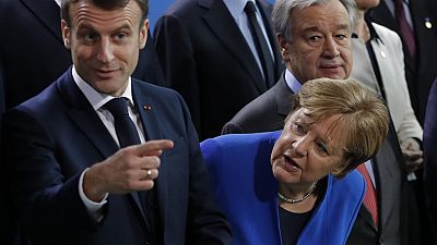 (L-R) French President Emmanuel Macron, German Chancellor Angela Merkel (Photo by Odd ANDERSEN / AFP)