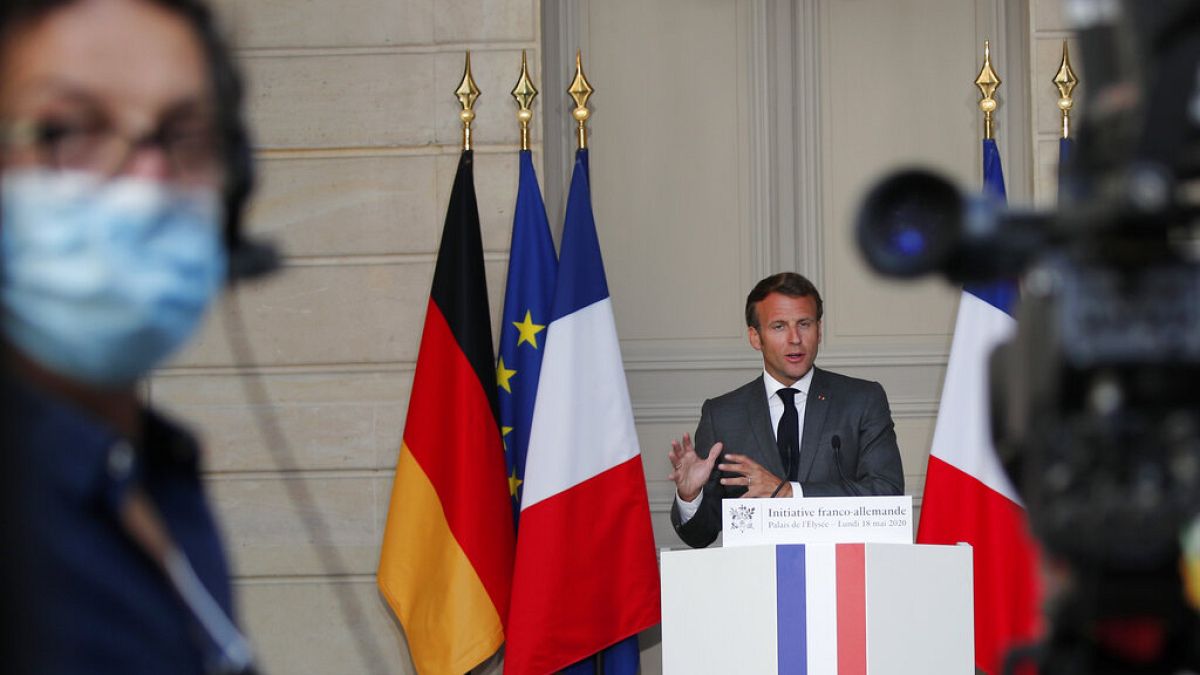 French President Emmanuel Macron speaks during a joint video press conference with German Chancellor Angela Merkel, at the Elysee Palace Monday, May 18, 2020 in Paris