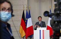 French President Emmanuel Macron speaks during a joint video press conference with German Chancellor Angela Merkel, at the Elysee Palace Monday, May 18, 2020 in Paris