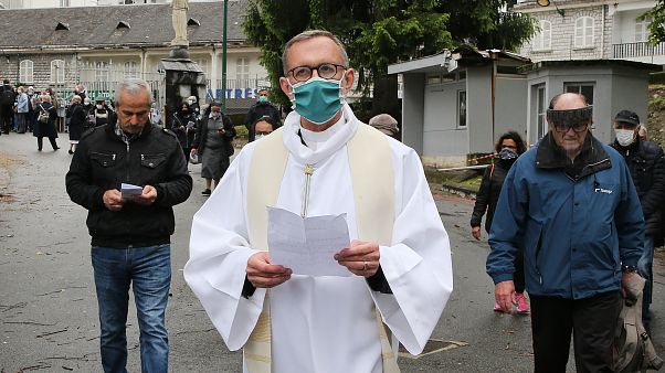 Olivier Ribadeau Dumas accompanies the first pilgrims into the Lourdes Roman Catholic sanctuary, in southwestern France, Saturday, May 16, 2020 Olivier Ribadeau Dumas accompanies the first pilgrims into the Lourdes Roman Catholic sanctuary, in southwestern France, Saturday, May 16, 2020