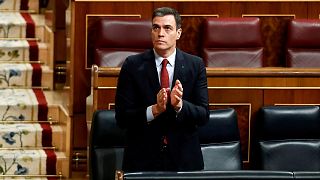 Spain's Prime Minister Pedro Sanchez applauds in parliament before a vote to approve the extension of the national lockdown in Madrid, Spain, Wednesday, March 25, 2020