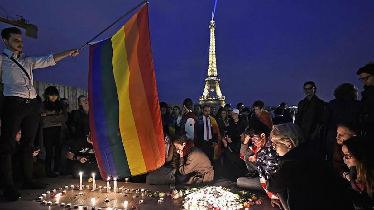 People in Paris pay tribute the victims of a mass shooting at an Orlando gay club, Monday, June 13, 2016.   -   Copyright  AP Photo/Martin Meissner