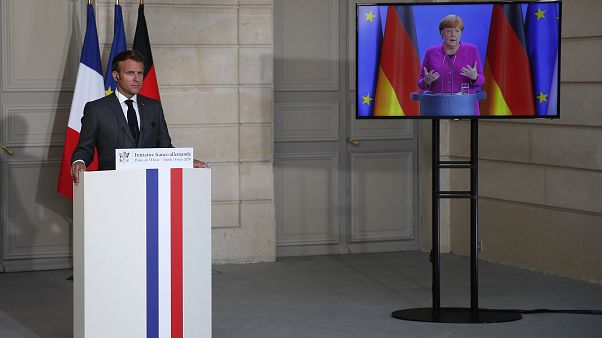 French President Emmanuel Macron listens to German Chancellor Angela Merkel during a joint video press conference Monday, May 18, 2020 in Paris. (AP/Francois Mori, Pool) French President Emmanuel Macron listens to German Chancellor Angela Merkel during a joint video press conference Monday, May 18, 2020 in Paris. (AP/Francois Mori, Pool)