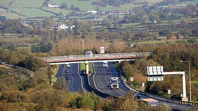 File - The M1 motorway crossing the Irish border near the town of Jonesborough, Republic of Ireland, looking across the border into Northern Ireland