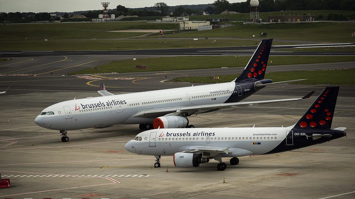 Planes from Brussels Airlines sit idle on the tarmac at Brussels Airport in Brussels, Tuesday, May 12, 2020. 