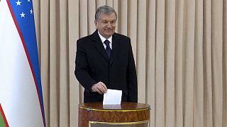 Uzbekistan's President Shavkat Mirziyoyev poses for a photo during the parliamentary elections at at a polling station in Tashkent, Uzbekistan, Sunday, Dec. 22, 2019