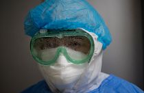 A woman looks at camera through her fogged up goggles in the intensive care unit for COVID-19, at the Guillermo Almenara hospital in Lima, Peru, Friday, May 22, 2020