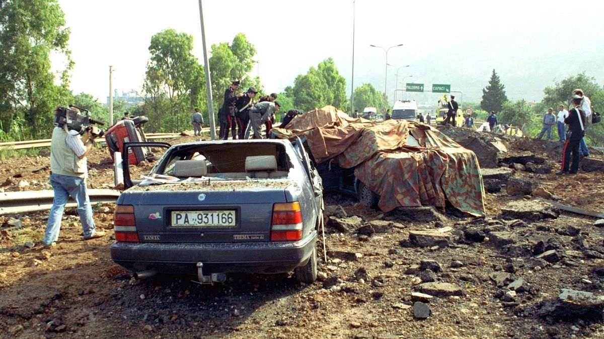 This May 23, 1992 file photo shows the damage at a highway that links Palermo to its airport after a bomb blast killed anti-Mafia prosecutor Giovanni Falcone.