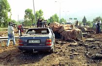 This May 23, 1992 file photo shows the damage at a highway that links Palermo to its airport after a bomb blast killed anti-Mafia prosecutor Giovanni Falcone.