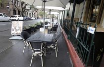 Tables go empty at a restaurant in Sydney, May 2020.