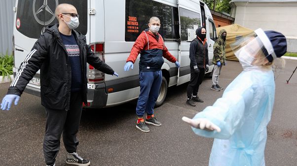 A group of conscripts, wearing face masks to protect against coronavirus, stand during a medical checkup at a military conscription office in Moscow, A group of conscripts, wearing face masks to protect against coronavirus, stand during a medical checkup at a military conscription office in Moscow,