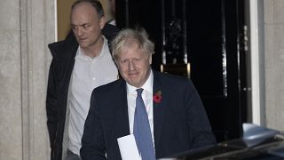 British Prime Minister Boris Johnson and his advisor Dominic Cummings, left, leave 10 Downing Street in London. 2019