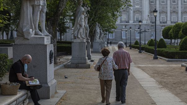 A man paints near the Royal palace in Madrid, Spain, Sunday, May 24, 2020 A man paints near the Royal palace in Madrid, Spain, Sunday, May 24, 2020