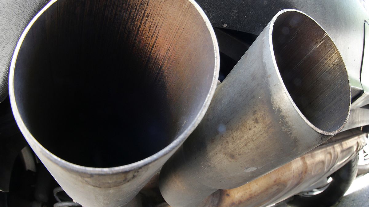 Aug. 2, 2017 file photo, the exhaust pipes of a VW Diesel car are photographed in Frankfurt, Germany. 