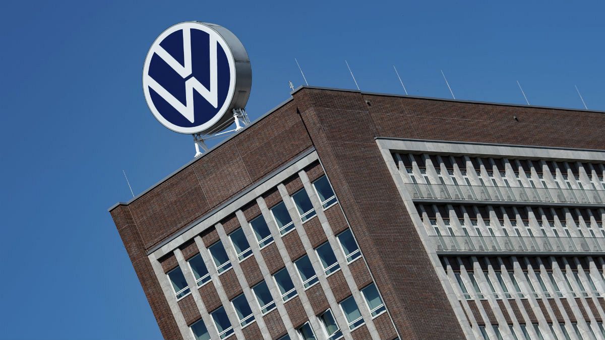 The Volkswagen logo stand on the top of a VW headquarters building in Wolfsburg, Germany