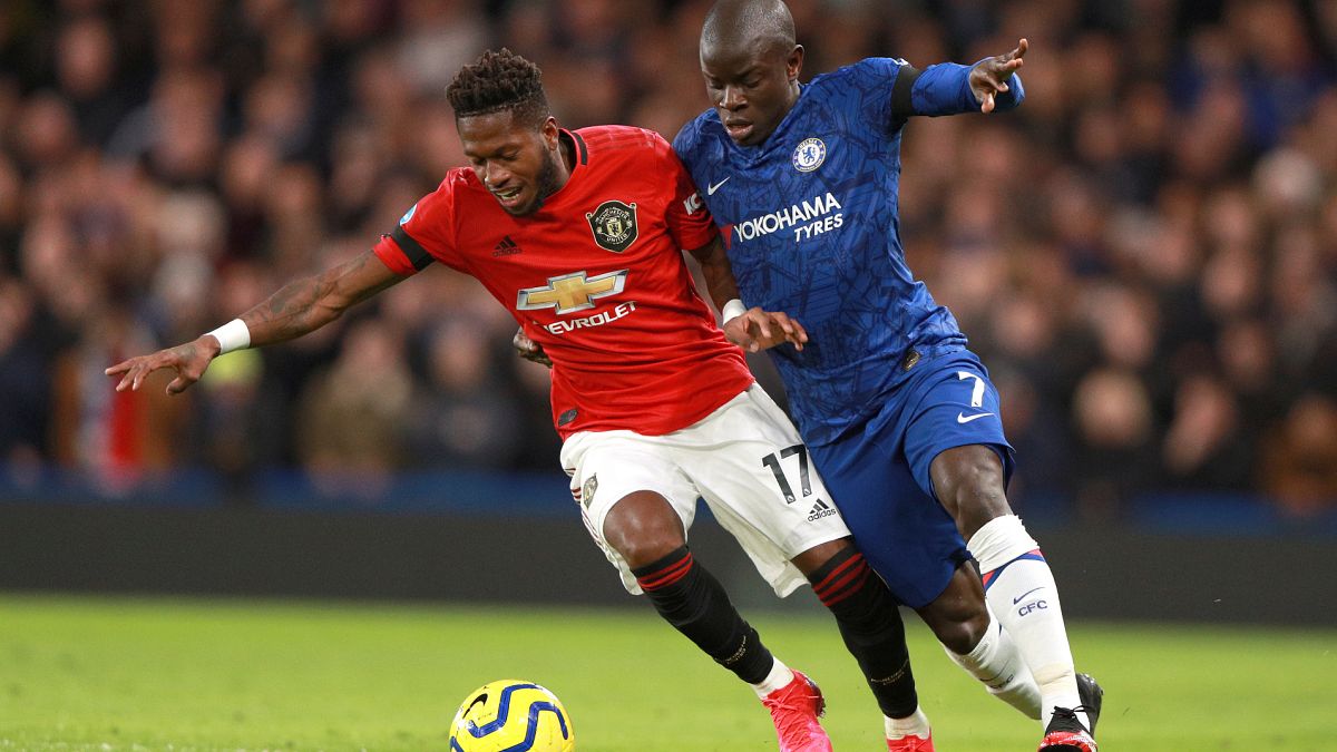 Manchester United's Fred, left, and Chelsea's N'Golo Kante battle for the ball