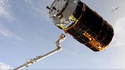 the Japan Aerospace Exploration Agency is released by a robotic arm from the International Space Station