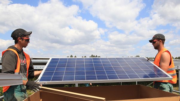 Workers install solar panels at the Constantine photovoltaic power station in Cestas, near Bordeaux, southwestern France, Friday, May 22, 2015. Workers install solar panels at the Constantine photovoltaic power station in Cestas, near Bordeaux, southwestern France, Friday, May 22, 2015.