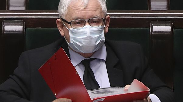 Poland's main ruling party leader, Jaroslaw Kaczynski, wears an anti-coronavirus mask in parliament. Poland's main ruling party leader, Jaroslaw Kaczynski, wears an anti-coronavirus mask in parliament.