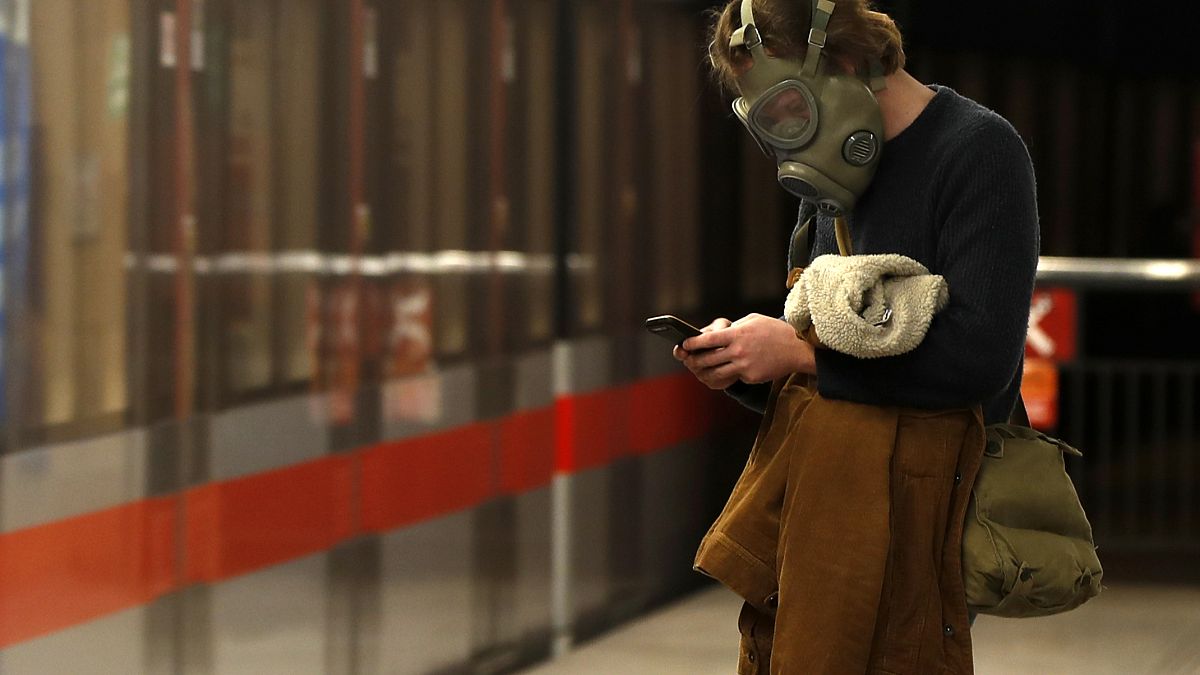 A man wearing a gas mask in Prague, Czech Republic