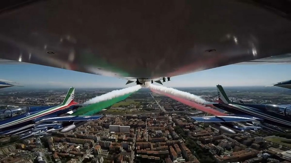 Acrobatic air force unit flying over Codogno with Italy's flag tricolour smoke