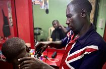 James, 30, has been helped to reintegrate into life in Nigeria after returning home from Libya. The IOM helped him to open a barbershop in Benin City, Edo State, Nigeria.