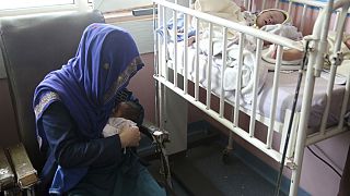 A mother breastfeeds her two-day-old baby at the Ataturk Children's Hospital, Kabul