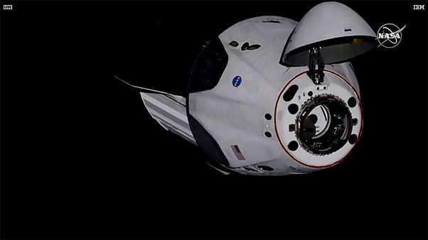 SpaceX Dragon crew capsule, with NASA astronauts, docks with the International Space Station SpaceX Dragon crew capsule, with NASA astronauts, docks with the International Space Station