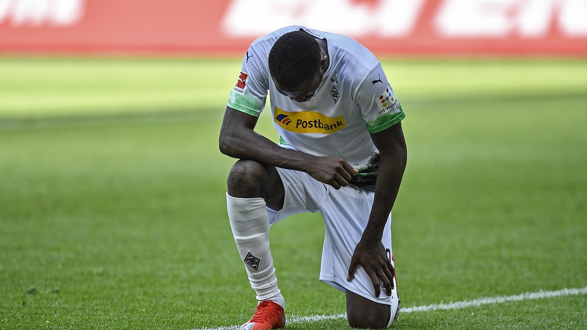 Moenchengladbach's Marcus Thuram taking the knee after scoring his side's second goal during the Bundesliga soccer match between Borussia Moenchengladbach and Union Berlin.