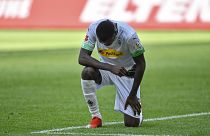 Moenchengladbach's Marcus Thuram taking the knee after scoring his side's second goal during the Bundesliga soccer match between Borussia Moenchengladbach and Union Berlin.