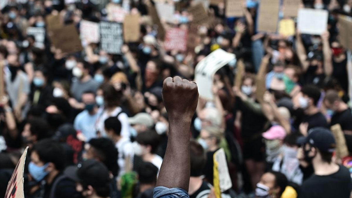 Protesters demonstrate on June 2, 2020, during a "Black Lives Matter" protest in New York City. Anti-racism protests have put several US cities under curfew to suppress riots