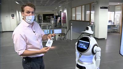 Euronews correspondent Jack Parrock trying out the Cruzr Health robot at the Antwerp University Hospital.